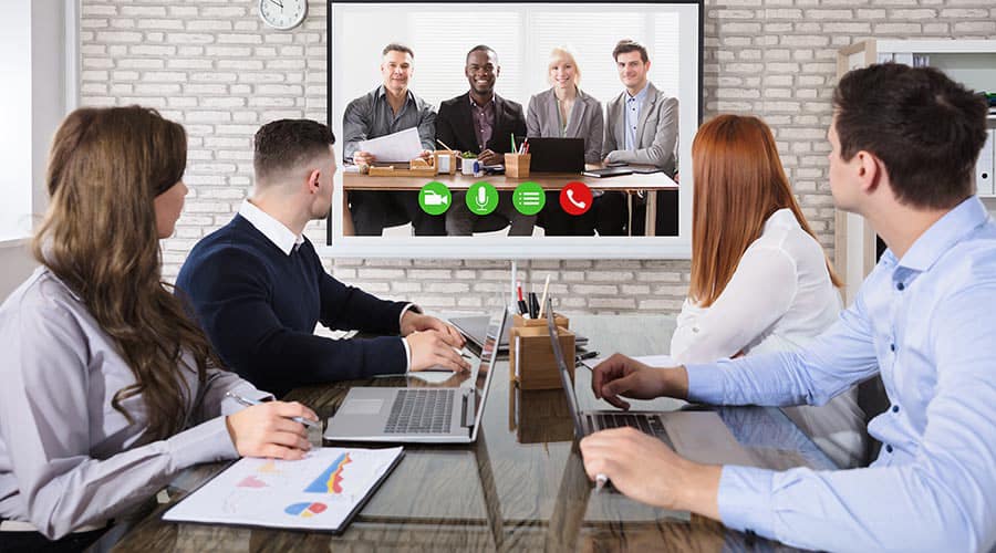 Business team using VoIP phones for seamless communication